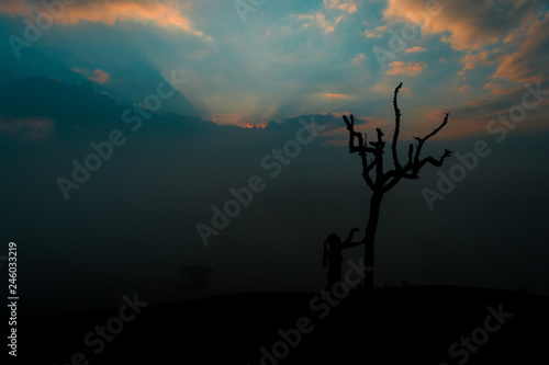 SILHOUETTE OF WOMAN AT SUNRISE