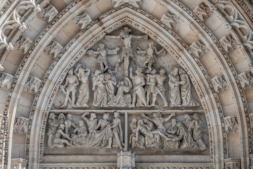 Crucifixion of Christ scene at major entrance portal of Saint Vitus Cathedral in Prague  Czech Republic  details  closeup