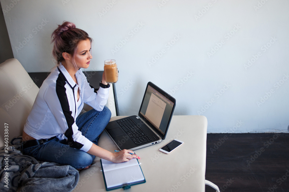 Young female student or entrepreneur working from home. Remote work Young female student or entrepreneur working from home. Remote work