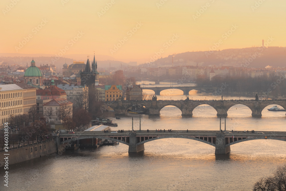 Golden sunset view of Prague from Letna park with bridges over Vltava river and Charles bridge. Prague. Czech Republic.