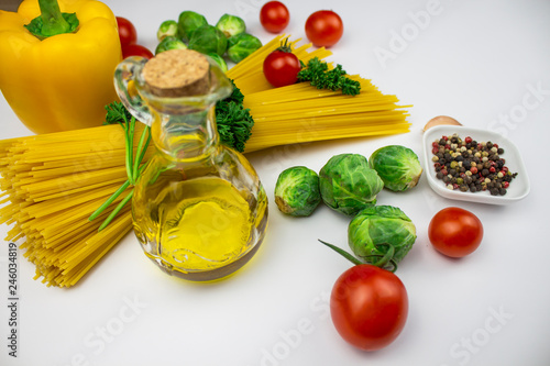 Food background. isolate Various culinary ingredients with spaghetti and vegetables and butter. Top view with copy space.