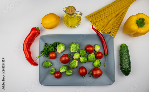 Fototapeta Naklejka Na Ścianę i Meble -   Fresh vegetables. Colorful vegetables background. Healthy vegetable. Assorted fresh vegetables close-up. Healthy food. Isolated on white background. space for text
