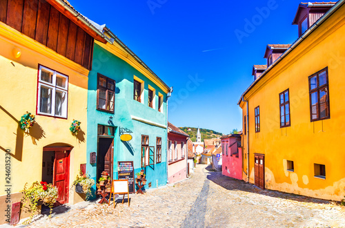 Sighisoara, Romania: Famous stone paved old streets with colorful houses in the medieval city-fortress Sighisoara,Transylvania, Europe
