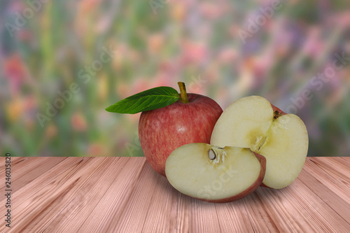 Red apple on wooden and blur background