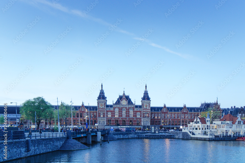 Obraz premium Street corner, touristic square, iconic house in Amsterdam, Holland. Ancient style.