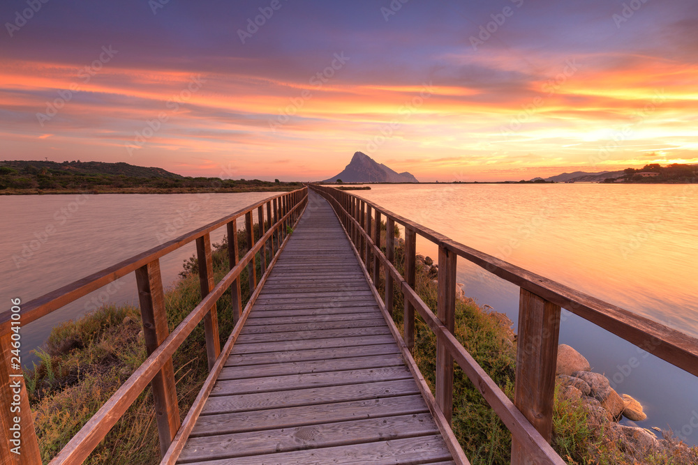 Sunrise from a pedestrian walkway, Porto Taverna, Loiri Porto San Paolo, Olbia Tempio province, Sardinia, Mediterranean Sunrise from a pedestrian walkway, Porto Taverna, Loiri Porto San Paolo, Olbia Tempio province, Sardinia, Mediterranean