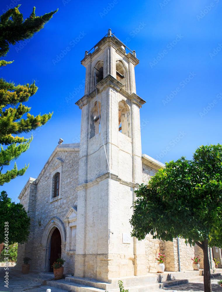 A large white the holy cross church with a bell tower in the Lefkara village mountains Troodos on the island of Cyprus