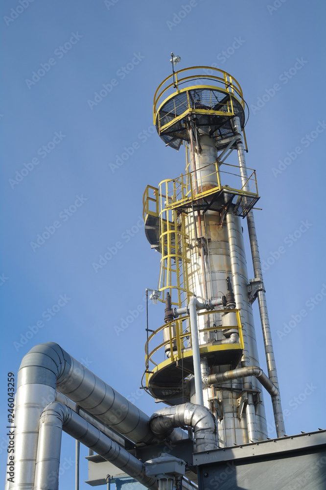 Column tower in petrochemical plant at twilight