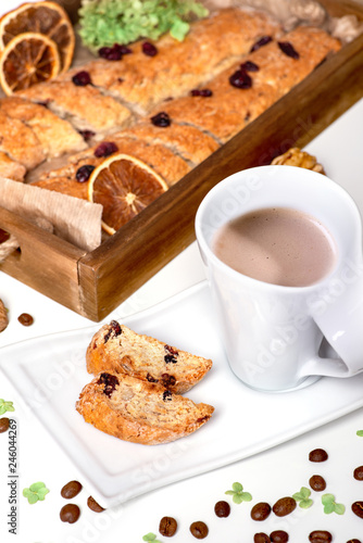 studio shot of homemade cakes on a wooden tray  with a cup of coffee