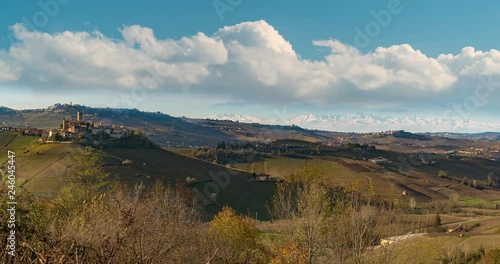 Hyper time lapse of Langhe vineyards panorama, Castiglione Falletto and La Morra, Unesco Site, Piedmont, North Italy, alps mountains background. photo