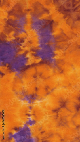 Abstract hand painted bright orange and purple fabric background pattern