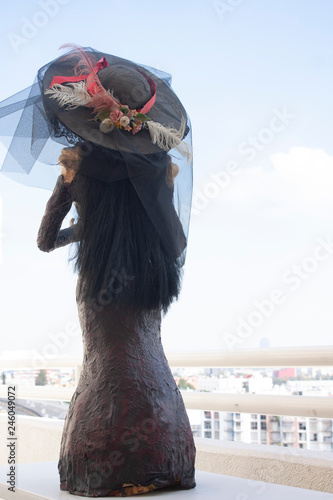 3D catrina sculpture in posture showing  back in Mexico City placing this type of sculptures in the offerings to celebrate the day of the dead. photo