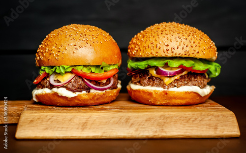 Two Delicious Fresh Homemade Burger on a Cutting Board
