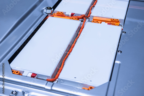 EV car battery pack. Electric car lithium battery pack. Blue toned. Car maintenance.