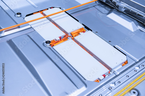 EV car battery pack. Electric car lithium battery pack. Blue toned. Car maintenance.