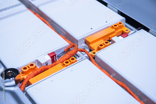 EV car battery pack. Electric car lithium battery pack. Blue toned. Car maintenance.
