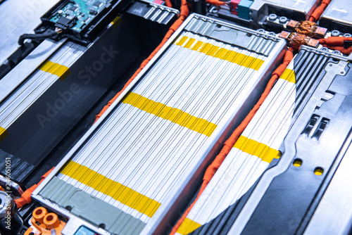 EV car battery pack. Electric car lithium battery pack. Blue toned. Car maintenance.