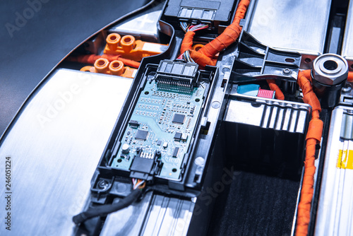 EV car battery pack. Electric car lithium battery pack. Blue toned. Car maintenance.