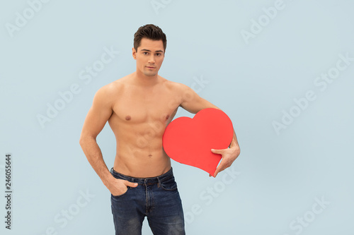 Photos Handsome man with red heart.
