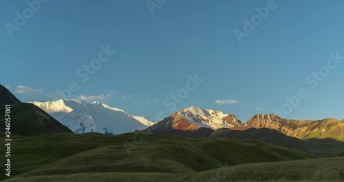 Time lapse video of panoramic view of Lenin Peak at sunrise from Tulpar Kol lake - Kyrgyz Pamir Mountains - Kyrgyzstan and Tajikistan border- Central Asia called 