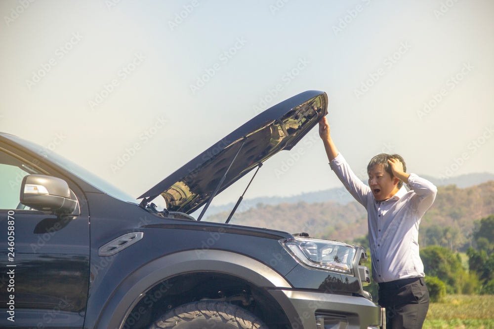 Man are very stressed because of his car breakdown. Man are very stressed because of his car breakdown.