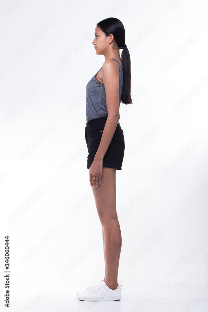 Beautiful Asian Long straight black hair tan skin woman in gray vast slim black short shoes, fresh face, studio lighting white background isolated copy space, full length snap rear side back view Beautiful Asian Long straight black hair tan skin woman in gray vast slim black short shoes, fresh face, studio lighting white background isolated copy space, full length snap rear side back view