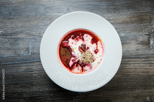 top view traditional ukrainian borscht decorated with sour cream