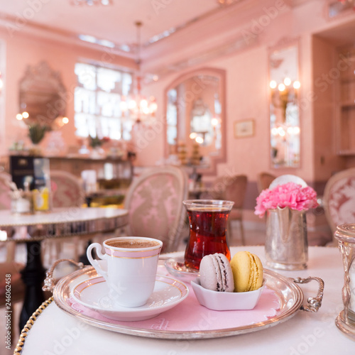 Traditional Turkish tea and coffee with sweets. French desserts. Macarons with lemon and blueberry. Vintage pink cafe. Old beautiful interior at the restaurant.
