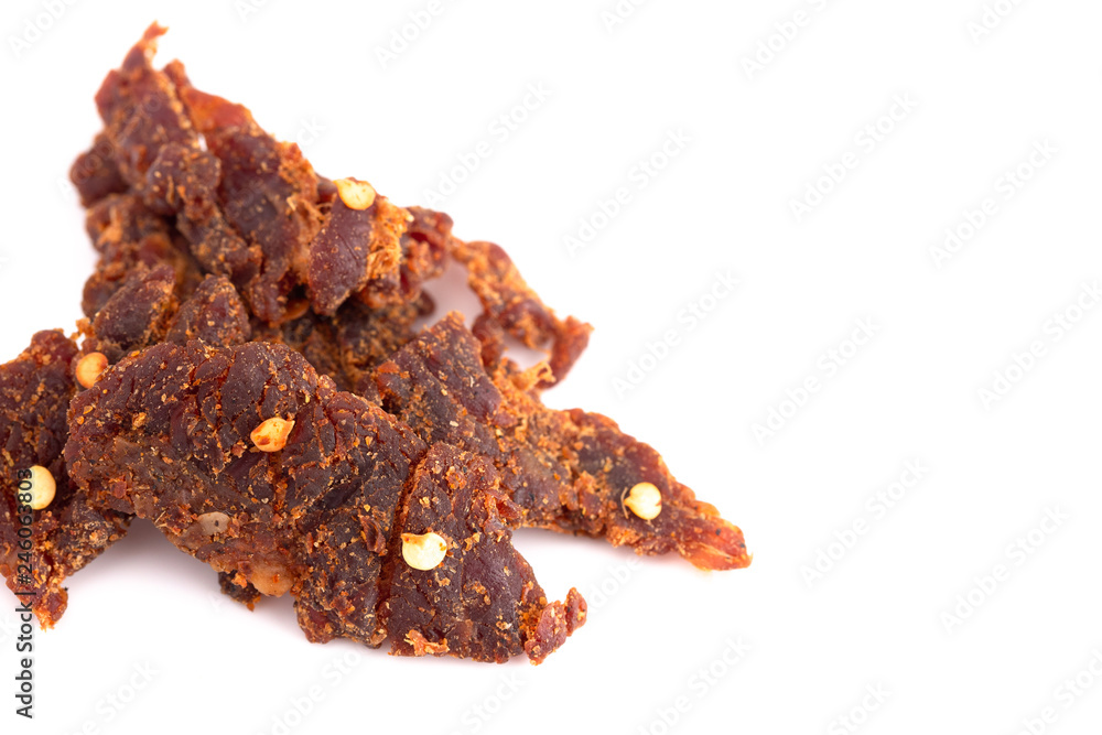 Pile of Red Pepper Beef Jerky on a White Background