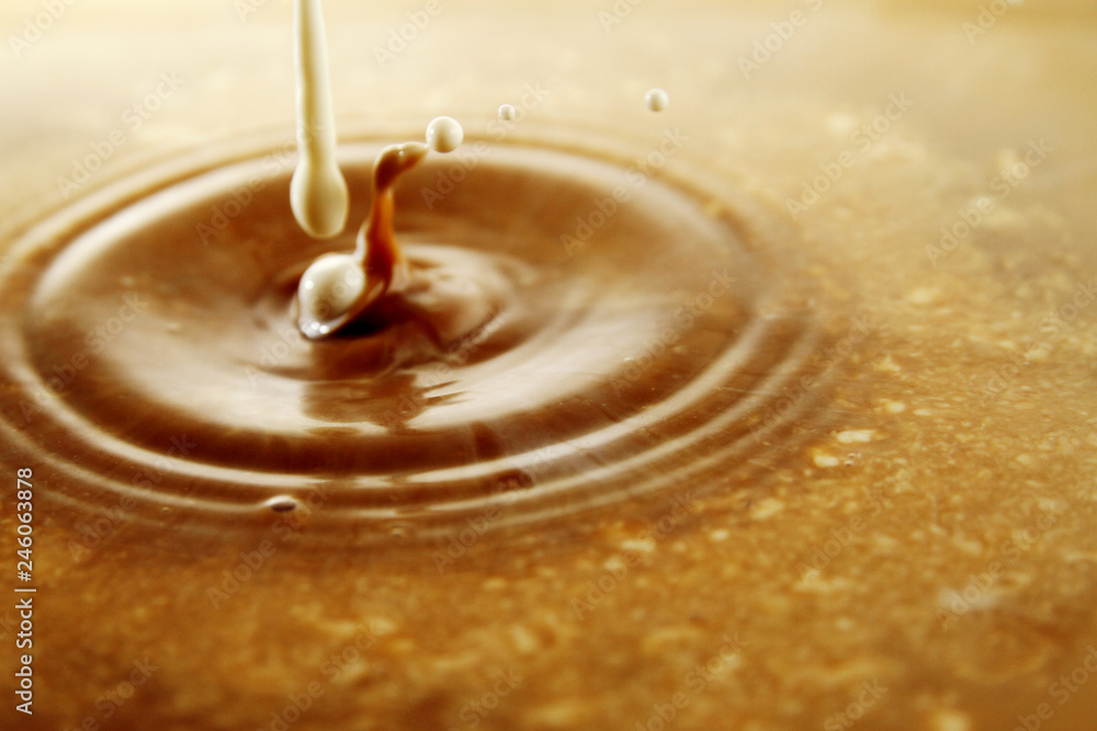 Coffee and Milk droplet as background Coffee and Milk droplet as background