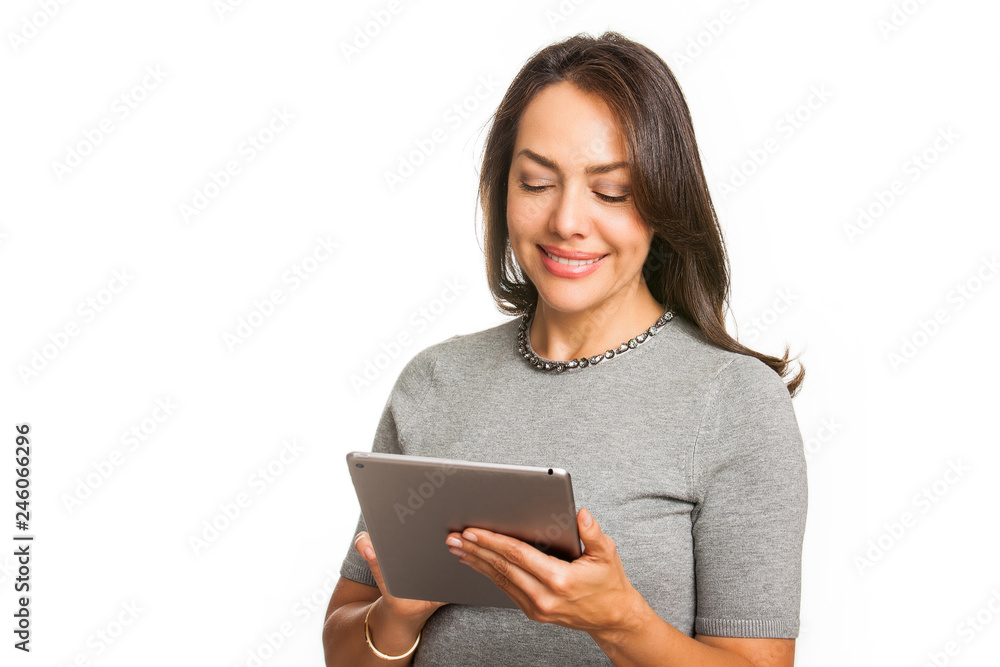 Young professional woman using a tablet isolated on white background Young professional woman using a tablet isolated on white background
