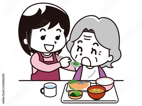 高齢女性に食事介助を行う女性介護士