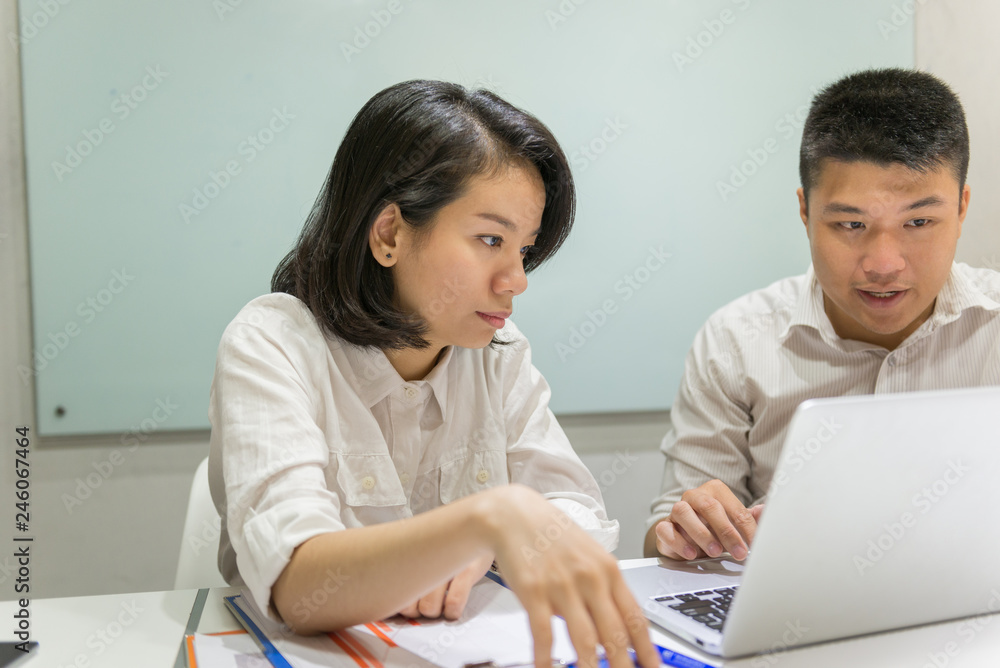 Young Asian employees working together in a team Young Asian employees working together in a team