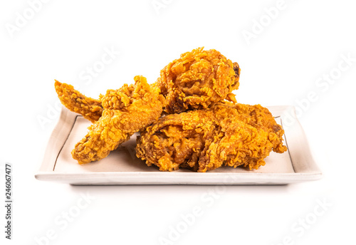 Fried chicken on a plate isolated on white