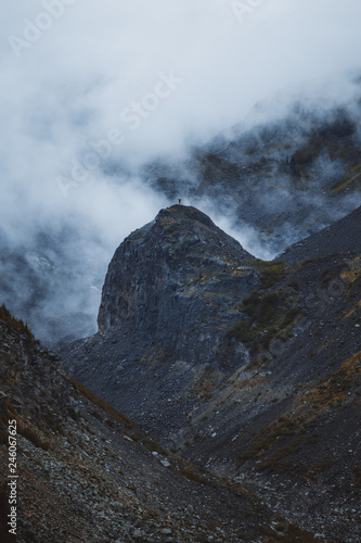 Girl standing on the mountain