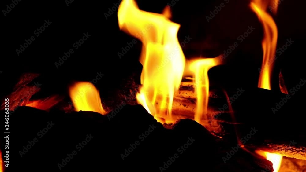 A fire burns in a fireplace. Close up view of fire flames A fire burns in a fireplace. Close up view of fire flames