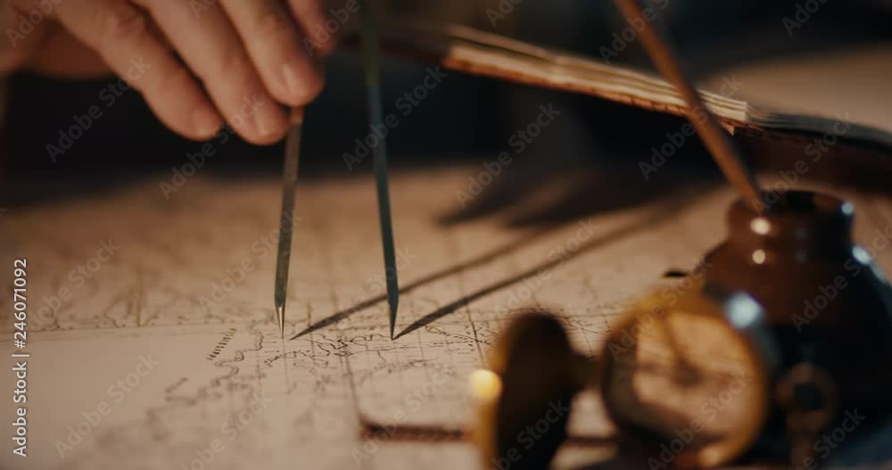 Different views of a vintage 1850 mapmaker using a compass divider ...
