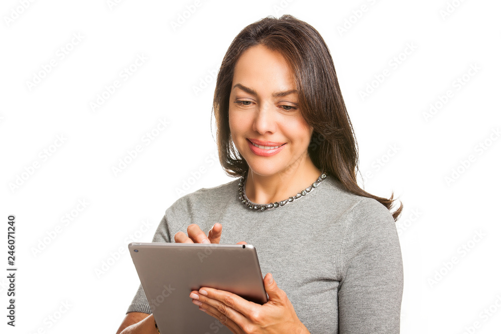 Young professional woman using a tablet isolated on white background Young professional woman using a tablet isolated on white background