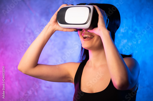 Woman looking with VR device and feeling excite © romankosolapov