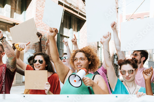 Colorful protesters marching through a city photo