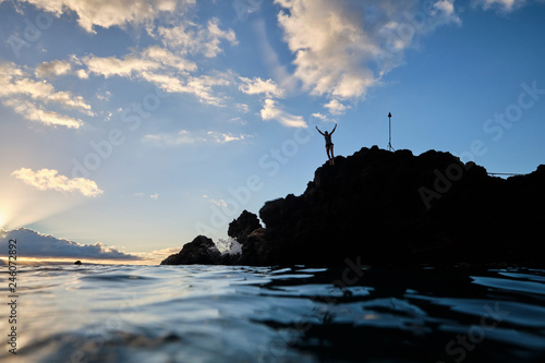 Hawaii people jumping into ocean from Black rock Ka'anapali photo