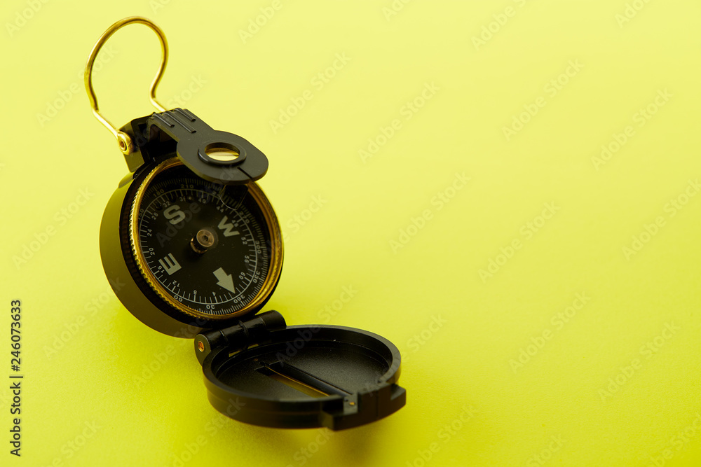 Minimal Compass on bright yellow background Minimal Compass on bright yellow background