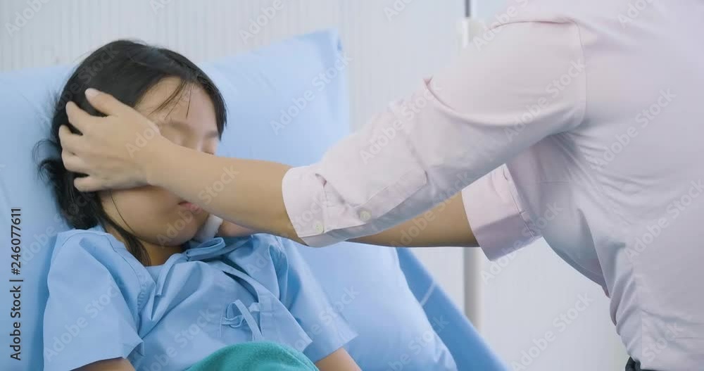 Mother is taking care his daughter on the bed in hospital. Mother is taking care his daughter on the bed in hospital.