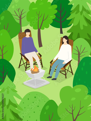 Men and women camping in the woods.