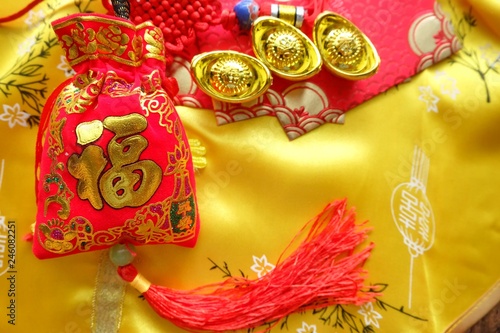 Red amulet bag. Chinese alphabet on red bag means good fortune and happinese. Chinese new year.