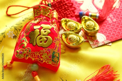 Red amulet bag. Chinese alphabet on red bag means good fortune and happinese. Chinese new year.