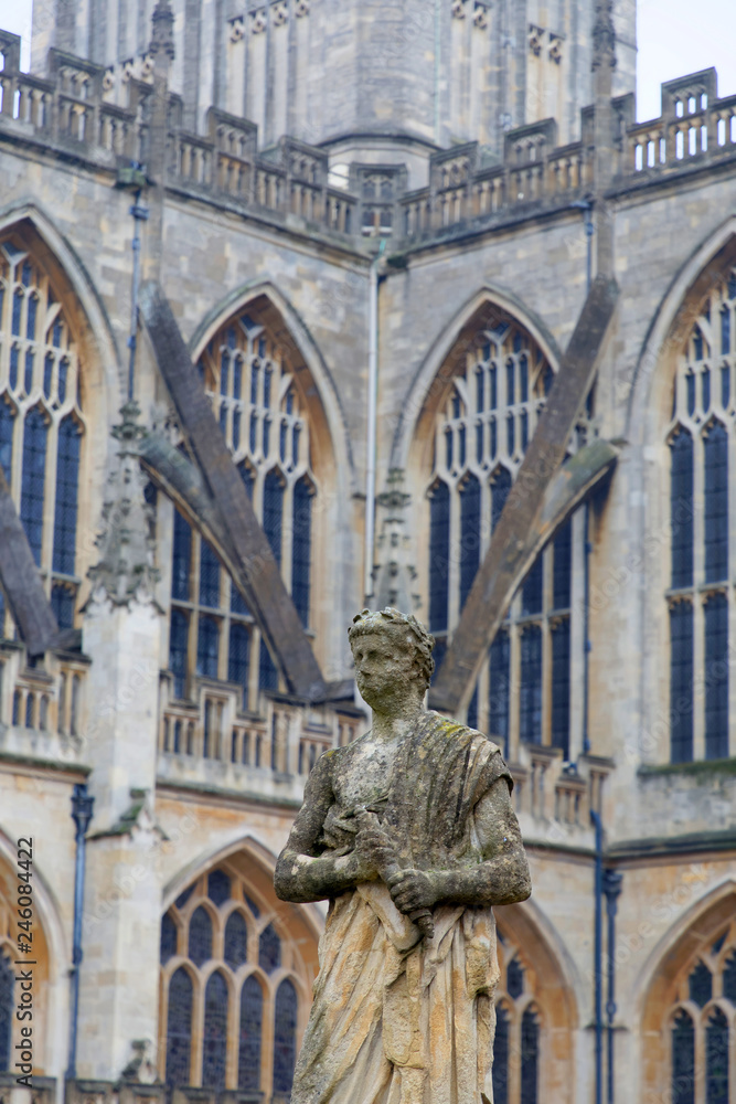 Statue of Julius Caecar at the Roman bath and the Bath Abbey in the background