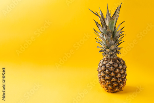 Pineapple on yellow background.