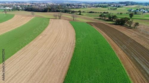 Amish Farm Workers Organically Fertilizing There Fields as seen by a Drone photo