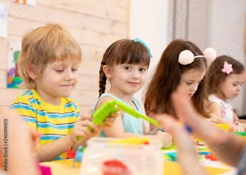 Large group of kids play wi...
